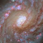 Hubble Captures Vibrant Spiral Starbursts 42 Million Light-Years Away